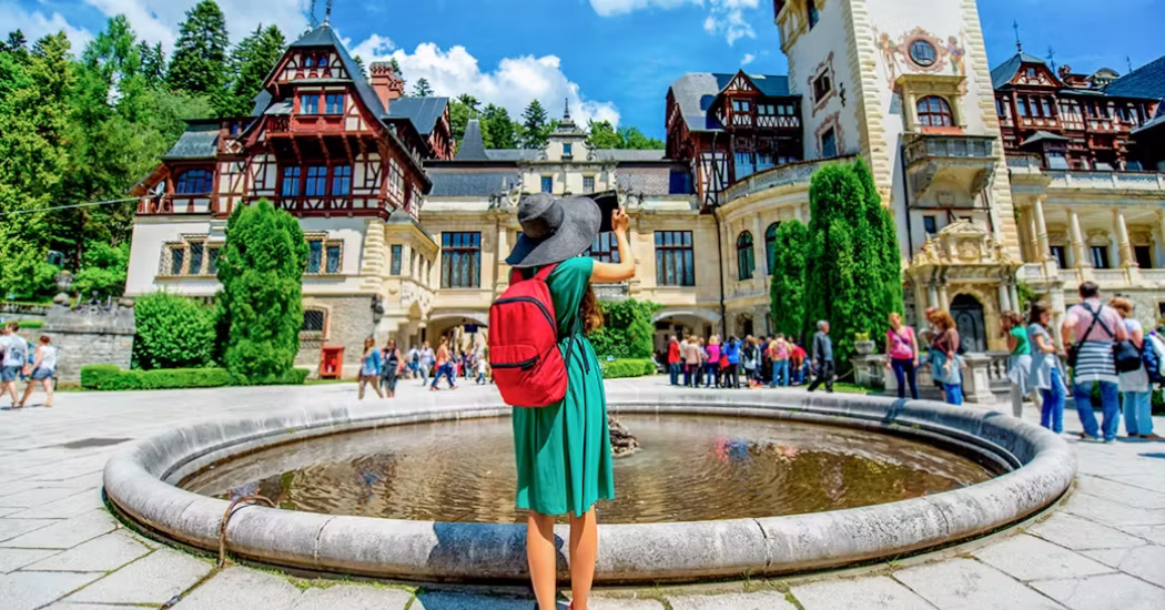 Tourists taking photos of Bran Castle.